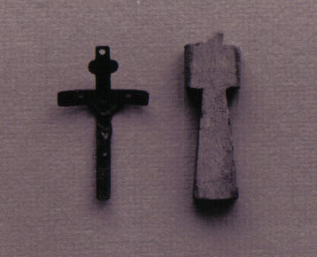 A metal crucifix and bone cross excavated from the Warden's Residence.