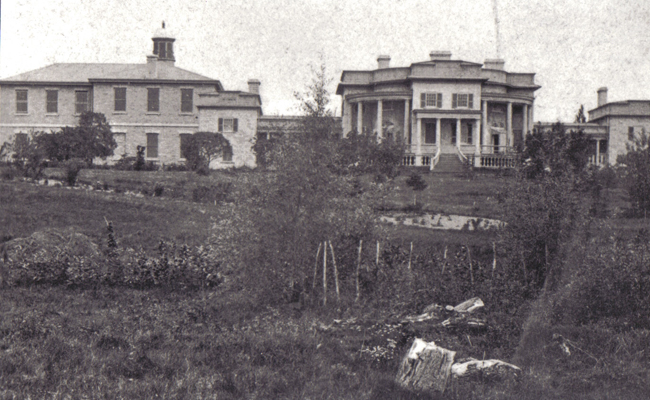 Photograph of Summerhill (with original Colonnades and parapets) at Queen's University - showing old medical building (1858 - with original fenestration) on the left-hand side
